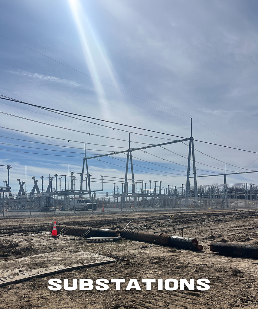 A substation with a lot of powerlines in front of a blue sky