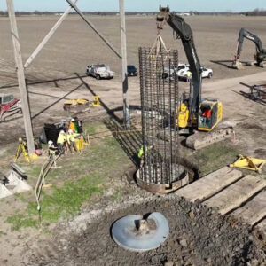 Markets-Self-Perform-Coffeen-1000x1000 Construction workers lower a large rebar cage into the ground