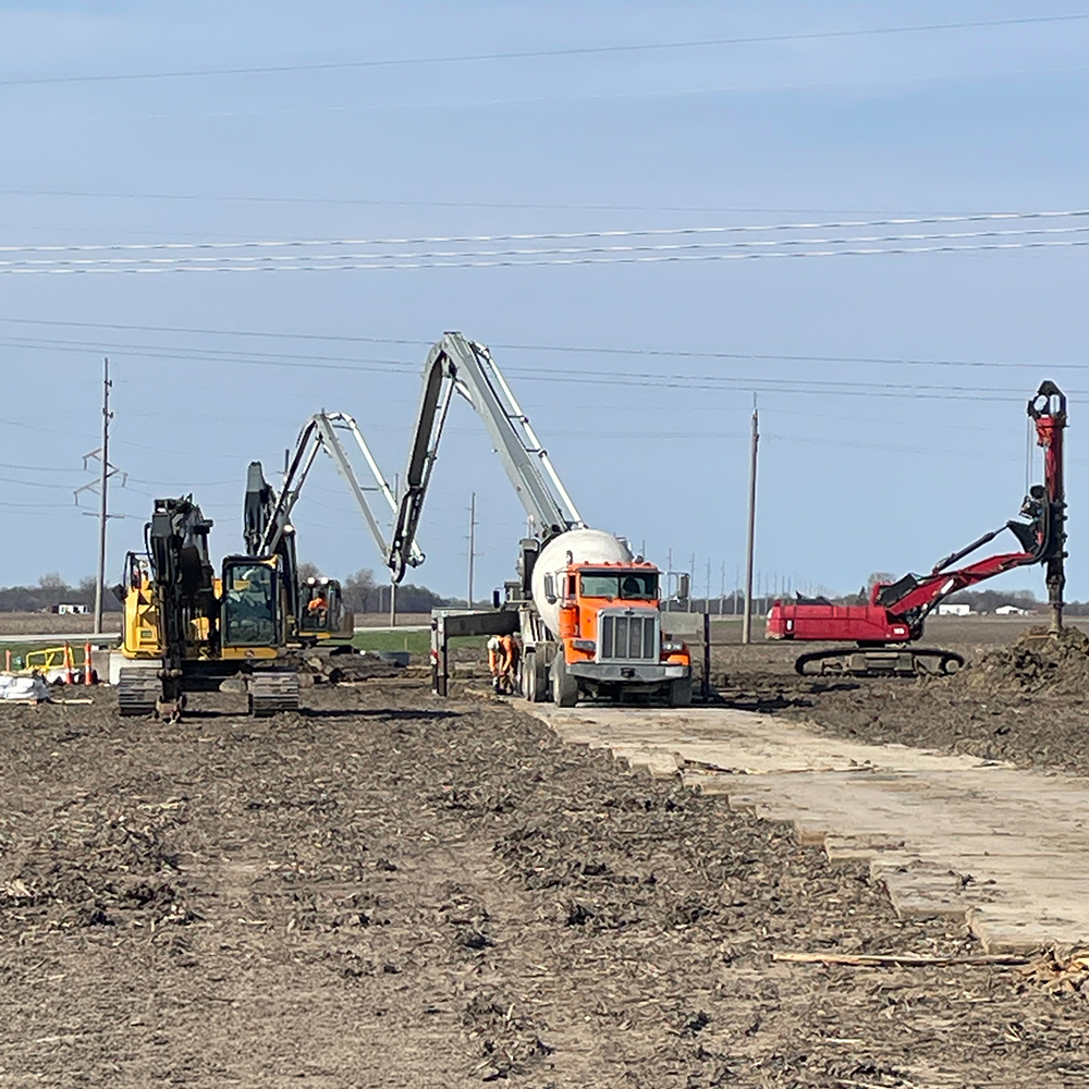 Ameren Taylorville Substation_500-2026-03-14-A9E8-1000x1000 A concrete truck pours concrete for the foundation of a utility line